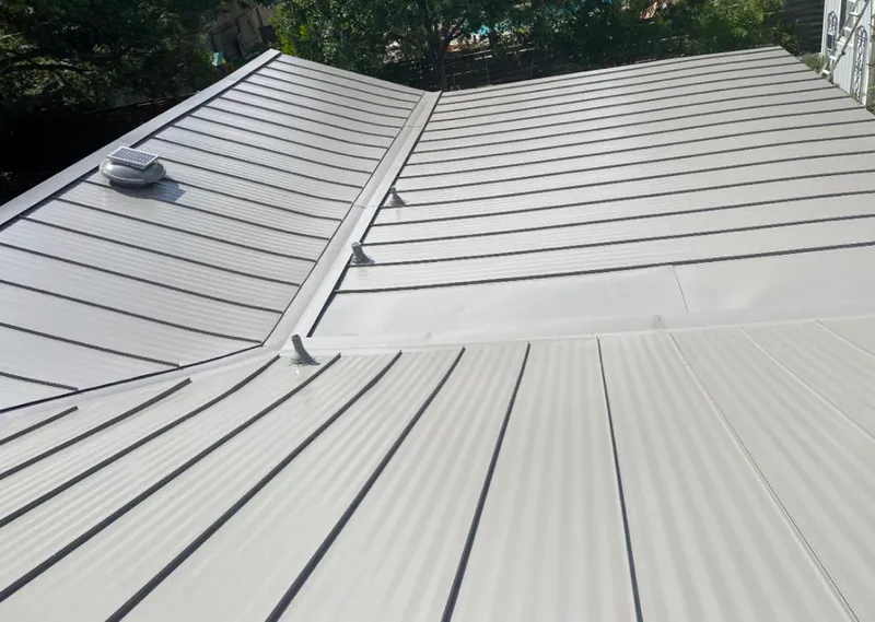 Solar attic fan installed on a metal roof for Roof Ventilation in East Windsor